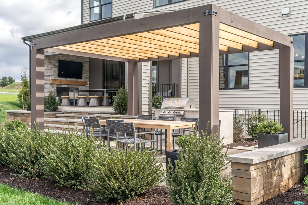 outdoor kitchen with pergola and bbq